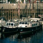 Idyllic view of moored boats in a serene harbor setting, perfect for travel themes.